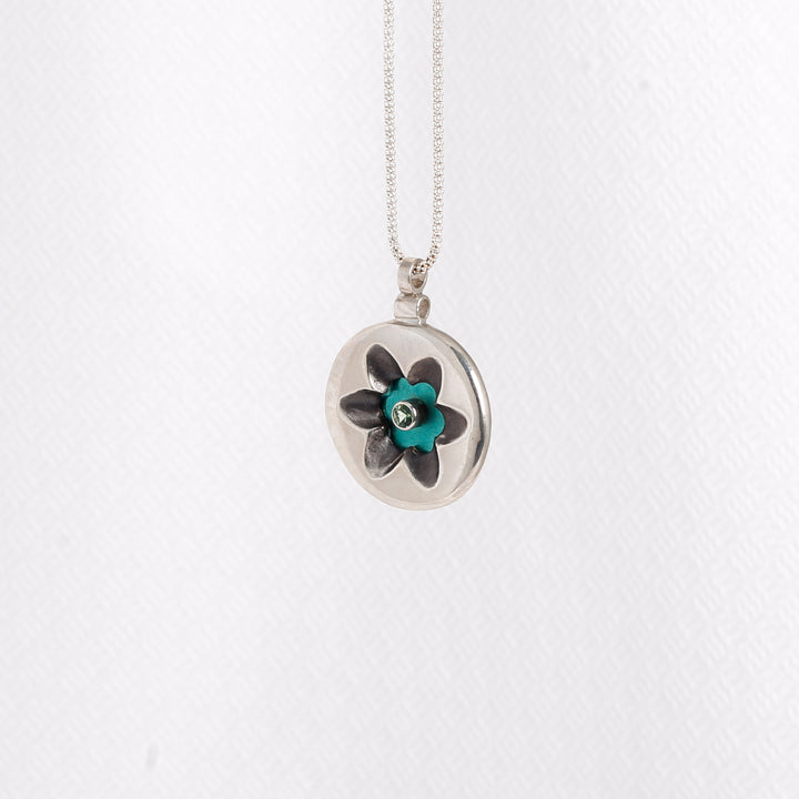 "Flower" pendant with Green Zircon on Seafoam Green Niobium