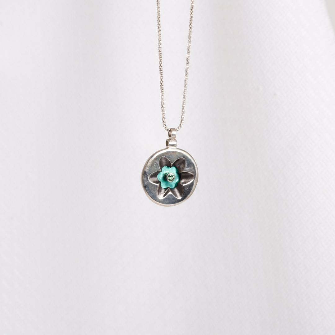 "Flower" pendant with Green Zircon on Seafoam Green Niobium