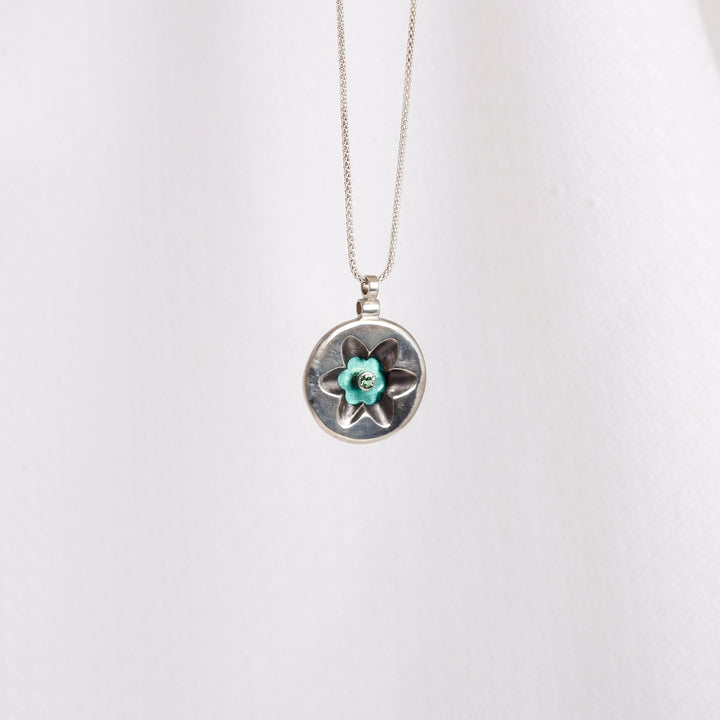 "Flower" pendant with Green Zircon on Seafoam Green Niobium