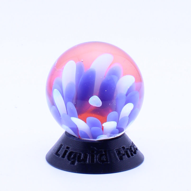 #5 Opal Eater Glass Flower Marble in blue white and red