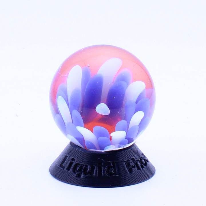 #5 Opal Eater Glass Flower Marble in blue white and red