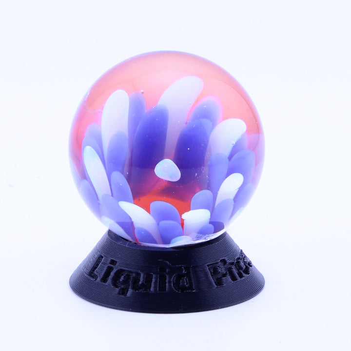 #5 Opal Eater Glass Flower Marble in blue white and red