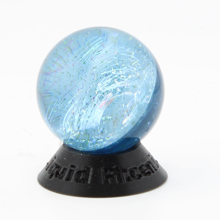 #10 Rainbow Dichroic Chaos Glass Marble on Sparkle Blue