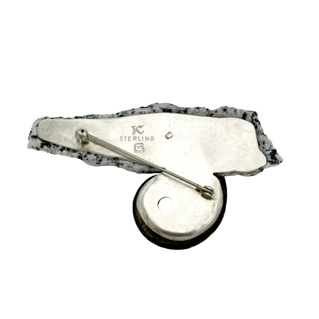 Pin 29, granite ammonite